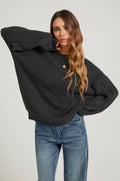 Pull en maille texturée noir, manches ajourées